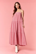 Red gingham printed maxi dress by PEACH LOVE, featuring a flowing silhouette and stylish dressy design.