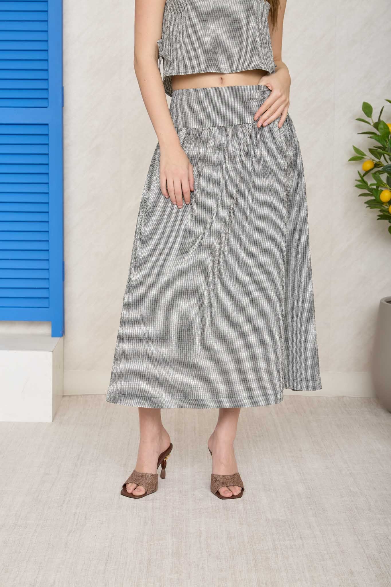 BLU PEPPER Marian plaid wideband waist skirt with a high waist and A-line silhouette, featuring a classic plaid pattern.