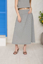 BLU PEPPER Marian plaid wideband waist skirt with a high waist and A-line silhouette, featuring a classic plaid pattern.