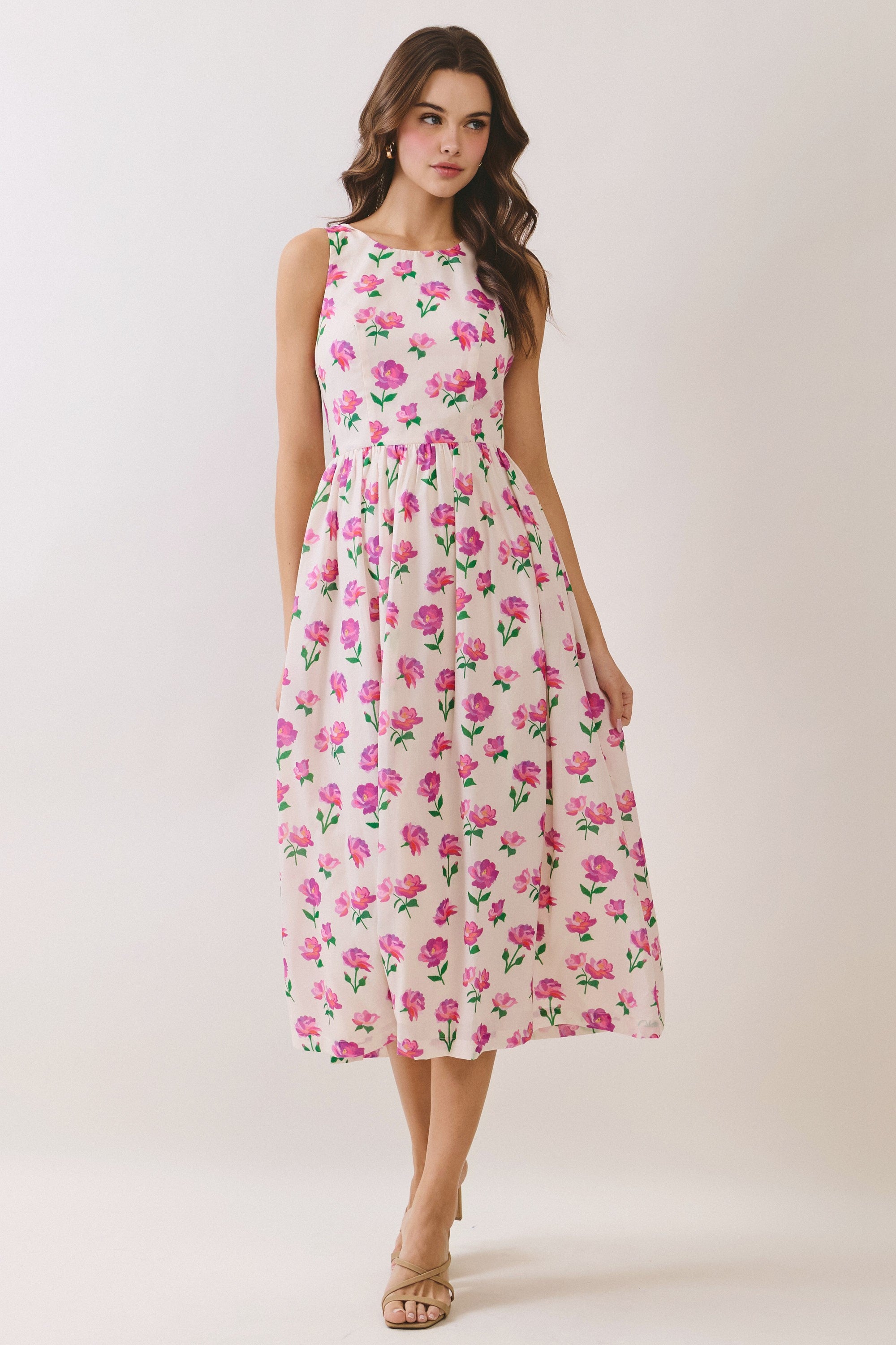 TCEC Randy floral bow back casual dress with ruffled hem, featuring a floral pattern and bow detail at the back.
