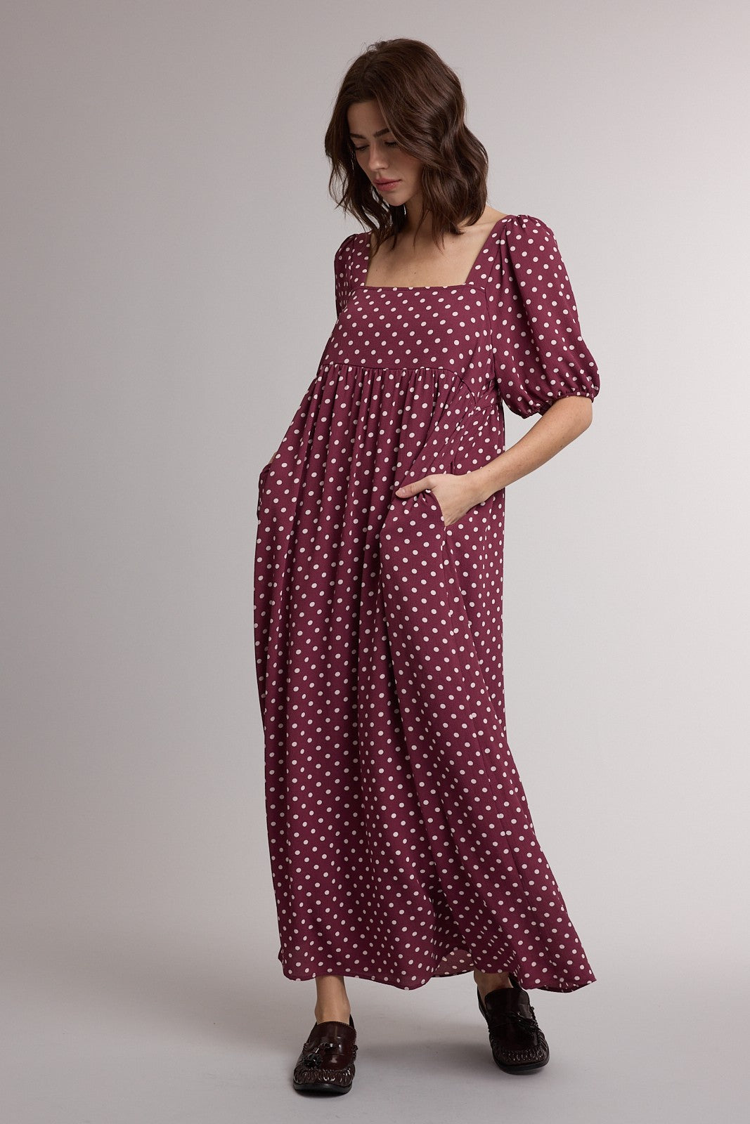 WISHLIST Betsy Polka Dot Puff Sleeve Dress displayed on a hanger, featuring a vintage-inspired design with puff sleeves and polka dot pattern.