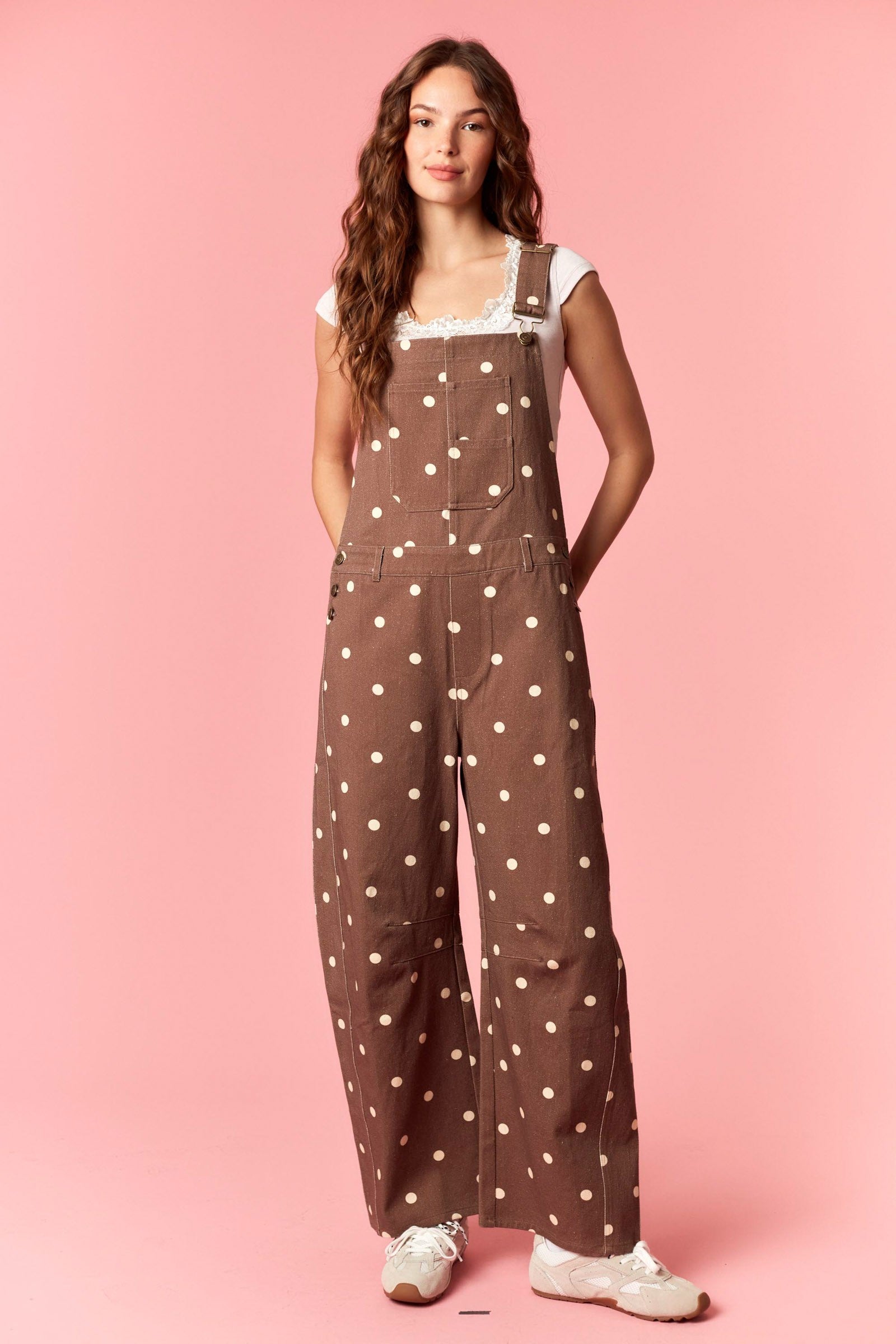 Peach Love Coco Polka Dot Jumpsuit with spaghetti straps and fitted waist, showcasing a stylish polka dot pattern on lightweight fabric.