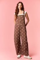 Peach Love Coco Polka Dot Jumpsuit with spaghetti straps and fitted waist, showcasing a stylish polka dot pattern on lightweight fabric.