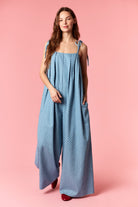 PEACH LOVE Ashley Polka Dot Wide Leg Jumpsuit from 153 Rompers, featuring a stylish polka dot pattern and wide-leg design.