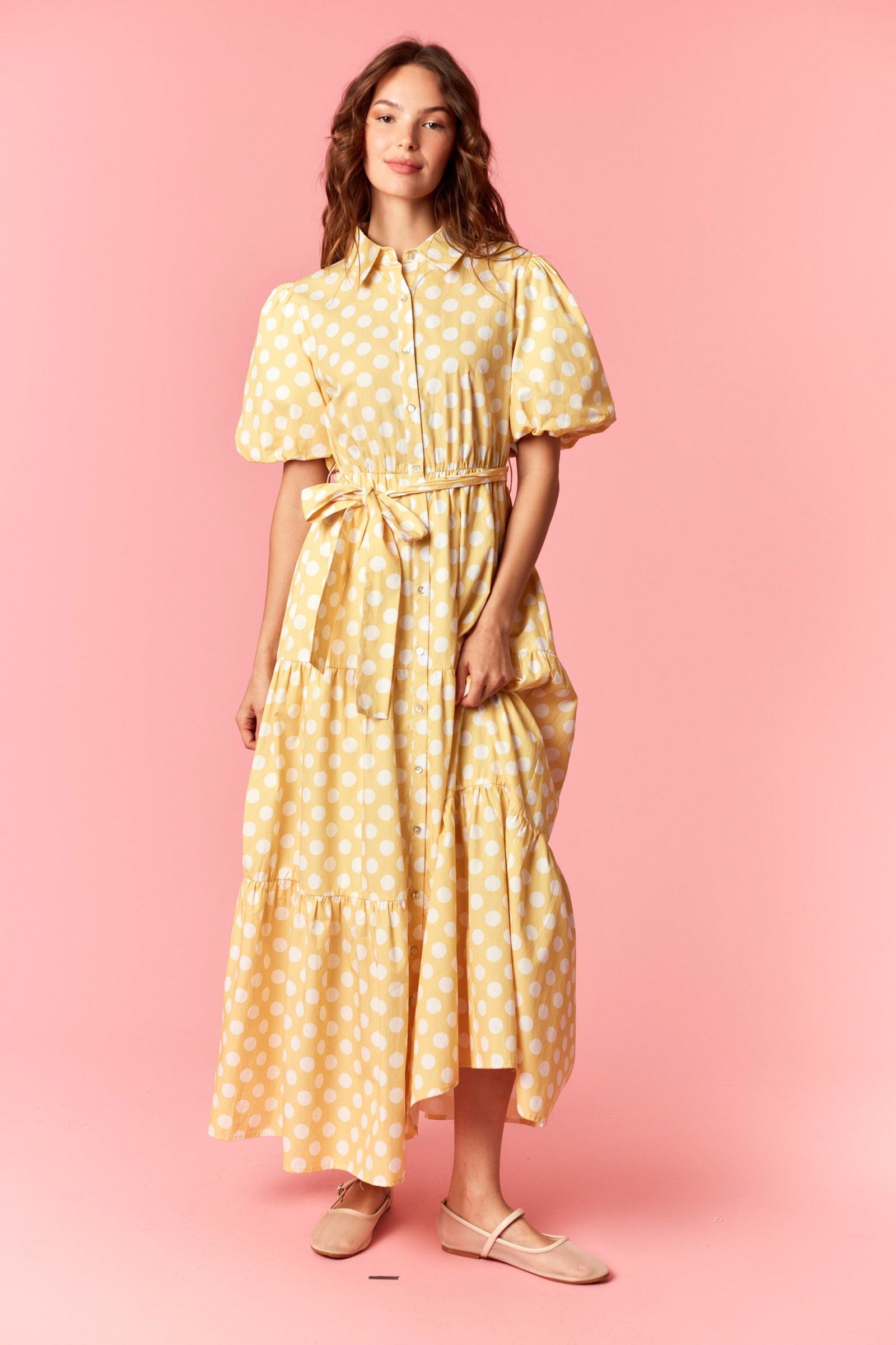 PEACH LOVE Everleigh Polka Dot Tiered Dress, a stylish 125 dressy dress with a tiered design and polka dot pattern, worn by a model.