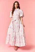 Everleigh floral printed tiered dress by PEACH LOVE featuring a flowy design and vibrant floral pattern.