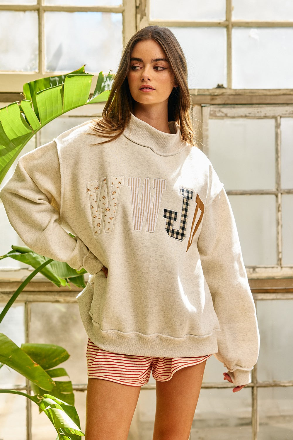Black BUCKET LIST WWJD mock embroidered sweatshirt with graphic design, featuring embroidered "What Would Jesus Do?" text on front.