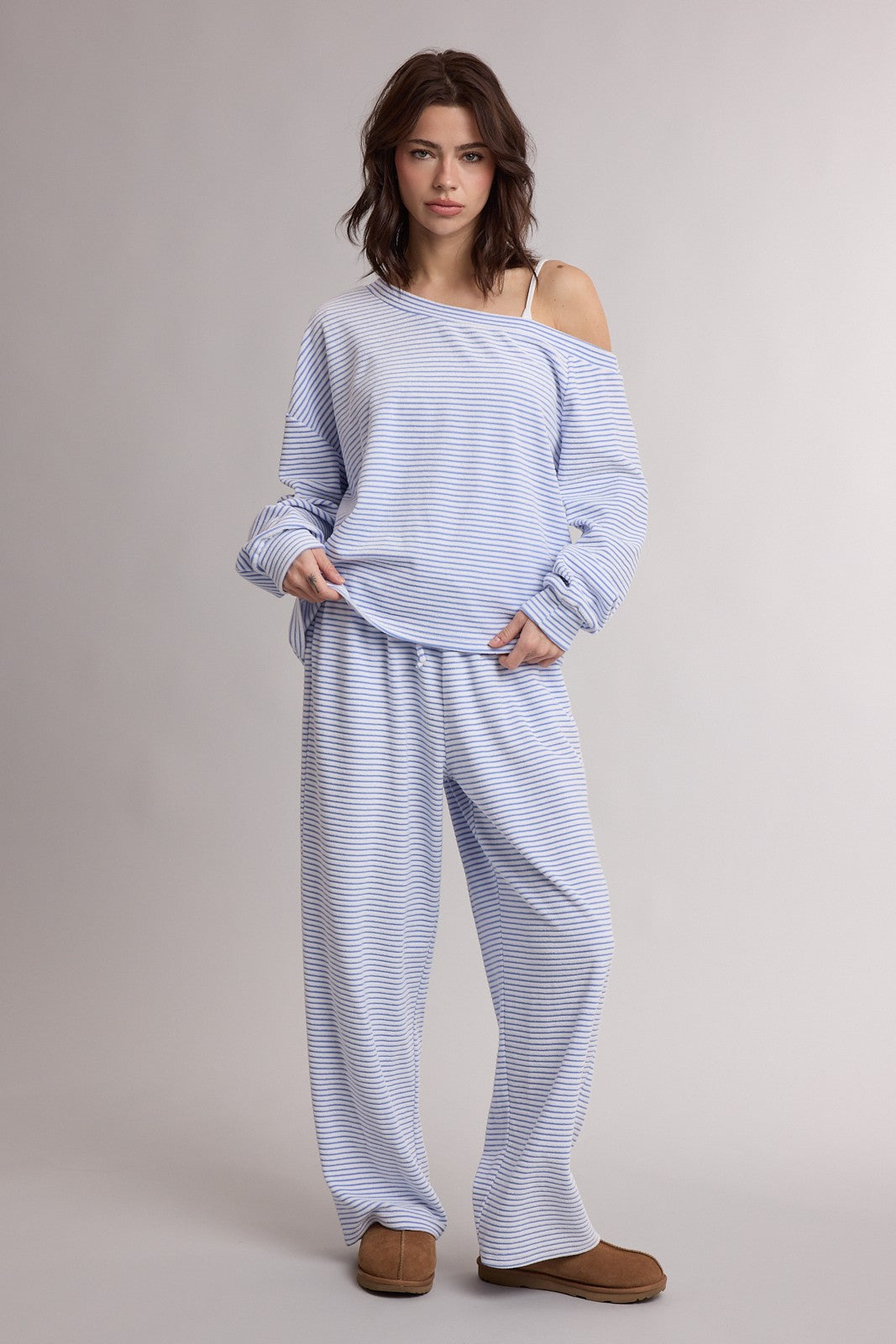 WISHLIST Sia striped one-shoulder pant set with 156 pants, featuring bold stripes and a stylish one-shoulder design.