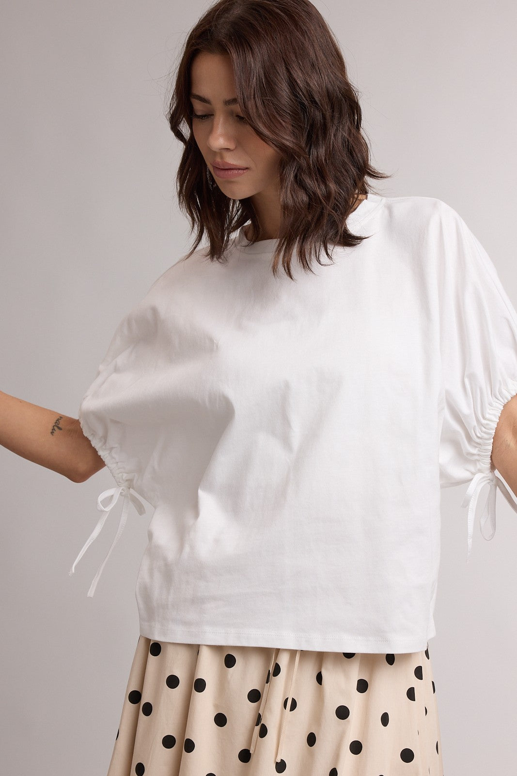 Off-white Dolly Dolman Sleeve Top by WISHLIST, casual 105 top with relaxed fit and flowy sleeves, shown on a model.