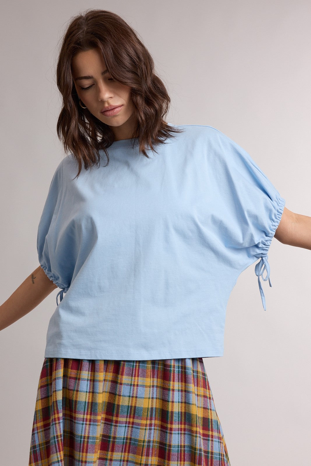 WISHLIST Dolly Sky Blue Dolman Sleeve Top, casual 105 top with loose fit and wide sleeves, shown on a model.