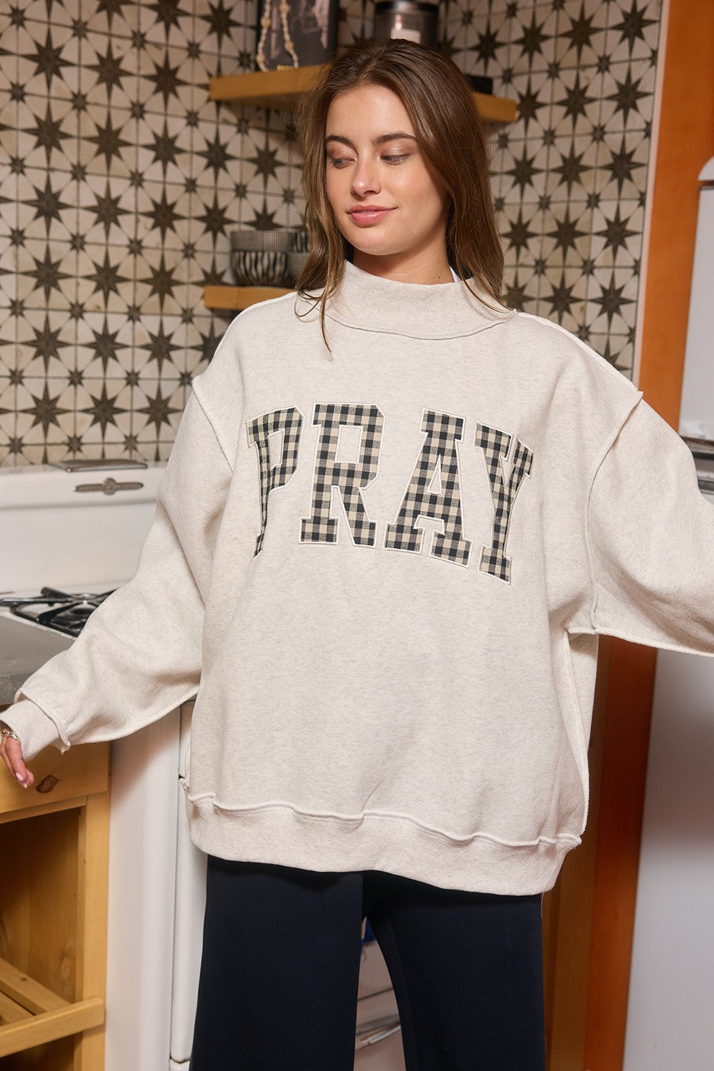 Pray Gingham Mock Neck Sweatshirt from BUCKET LIST, featuring a graphic design and gingham pattern, long sleeves, and a cozy fit.