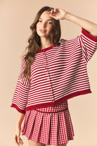 Red striped Izzie oversized sweater top with half sleeves from PEACH LOVE, perfect for fall casual wear.