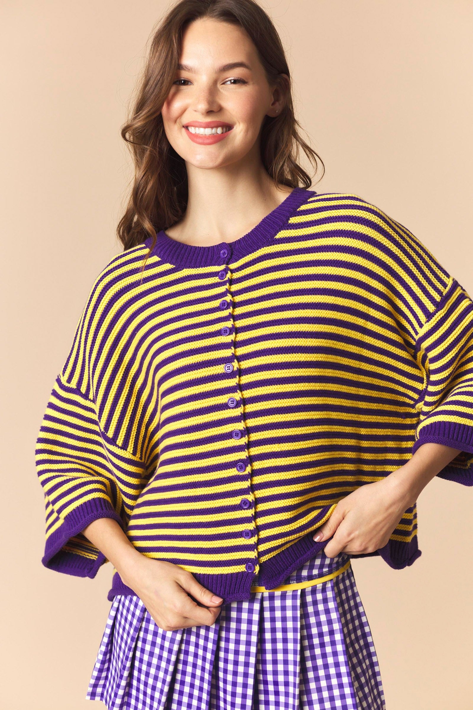 Purple striped oversized sweater top with half sleeves from PEACH LOVE's 132 Fall Sweaters collection, displayed on a hanger.