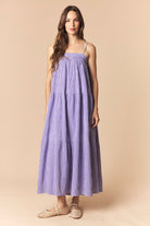 Sophie purple gingham printed maxi dress by PEACH LOVE, featuring a flowy silhouette and sleeveless design for elegant summer style.