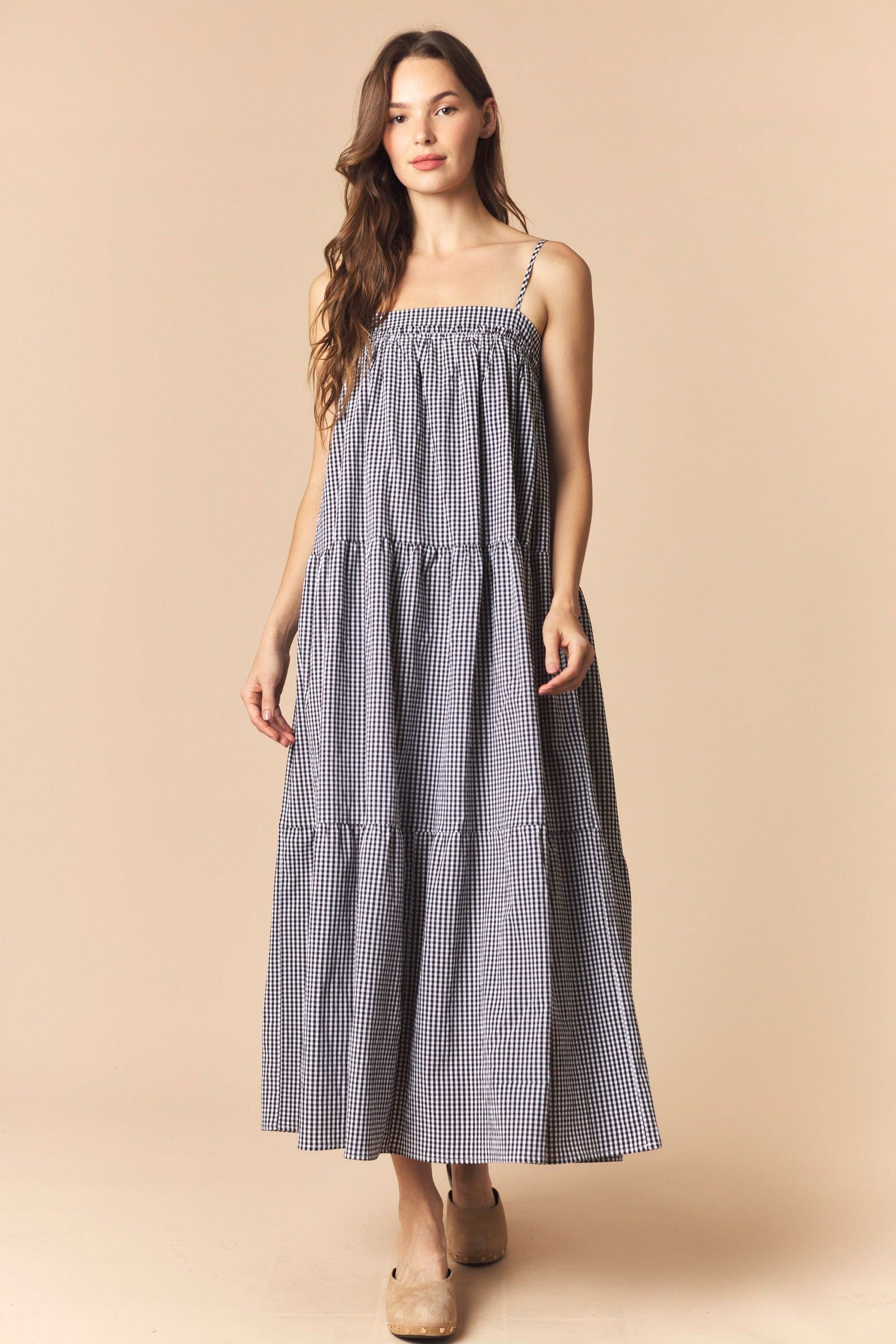 Black gingham printed maxi dress by PEACH LOVE with a flowy silhouette and sleeveless design for a stylish, dressy look.
