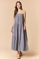 Black gingham printed maxi dress by PEACH LOVE with a flowy silhouette and sleeveless design for a stylish, dressy look.