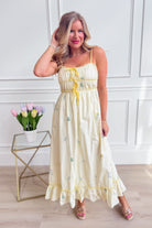 WISHLIST Avery triple bow floral midi dress with a fitted bodice and flowy skirt, featuring colorful floral patterns and elegant design.