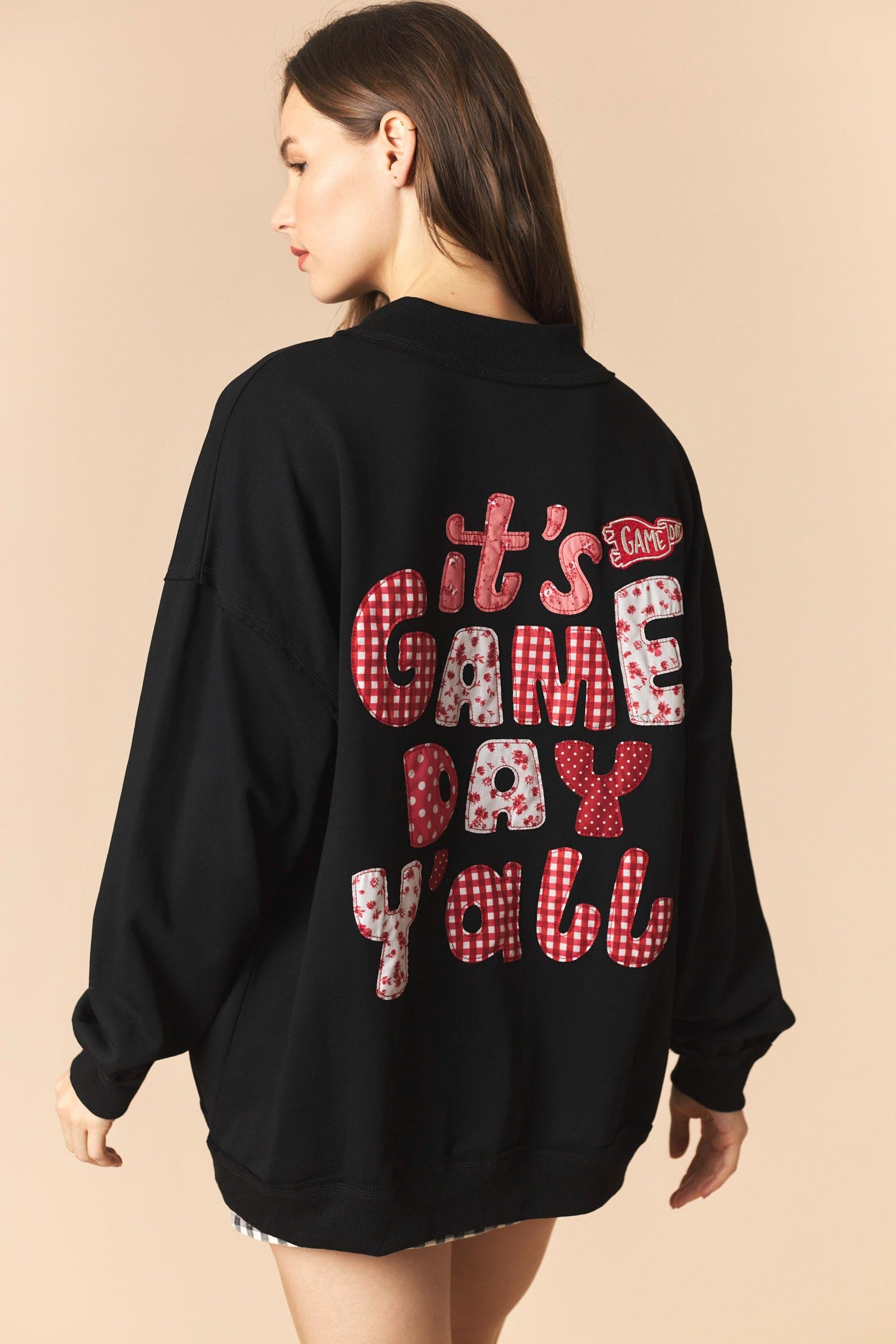 Black Cynthia Game Day Pullover by PEACH LOVE featuring graphic design, casual fit, and comfortable sweatshirt fabric.