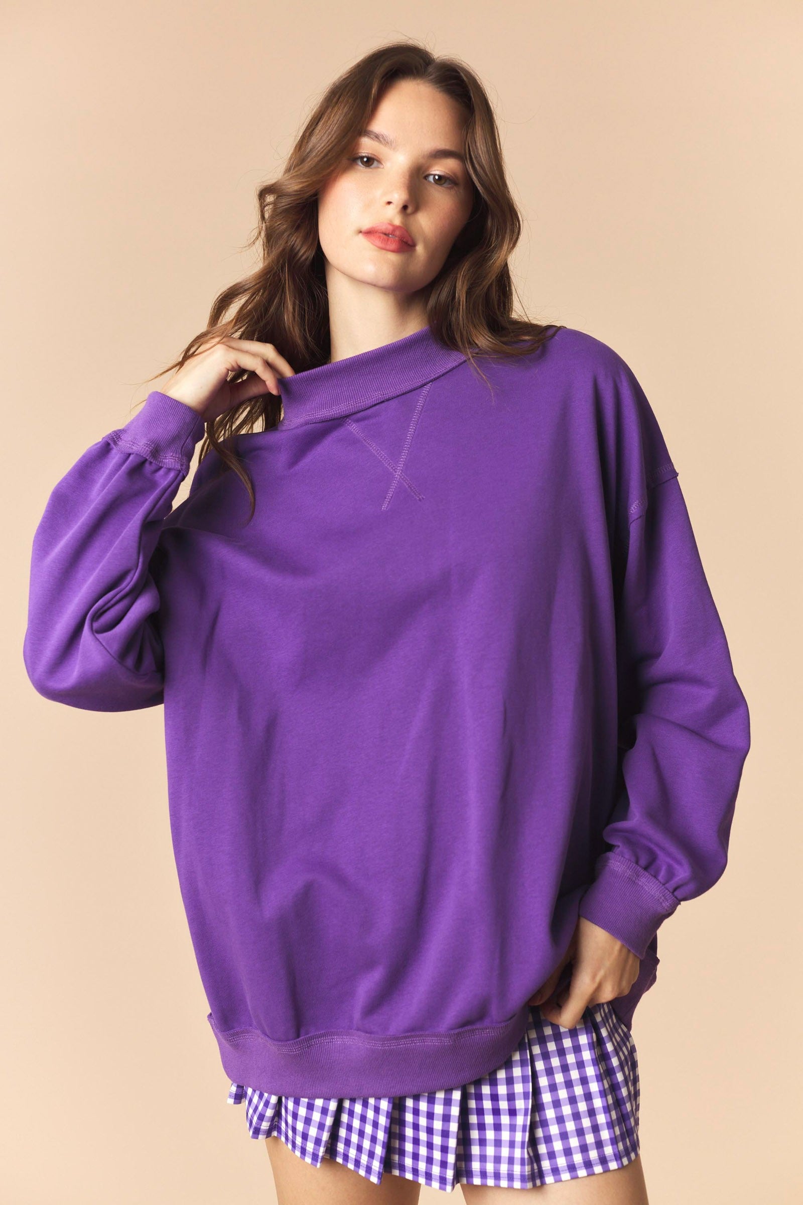 Purple Cynthia Game Day Graphic Sweatshirt by PEACH LOVE featuring bold game day design and comfortable fit.