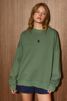 LE LIS Lynette Christmas Tree embroidered oversized sweatshirt with festive graphic design, cozy and stylish for winter wear.