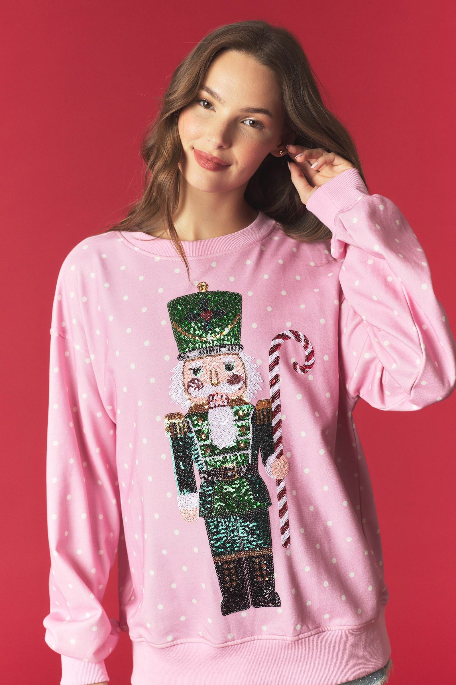 PEACH LOVE Minnie Nutcracker printed pullover sweatshirt featuring festive graphic design and comfortable fit.