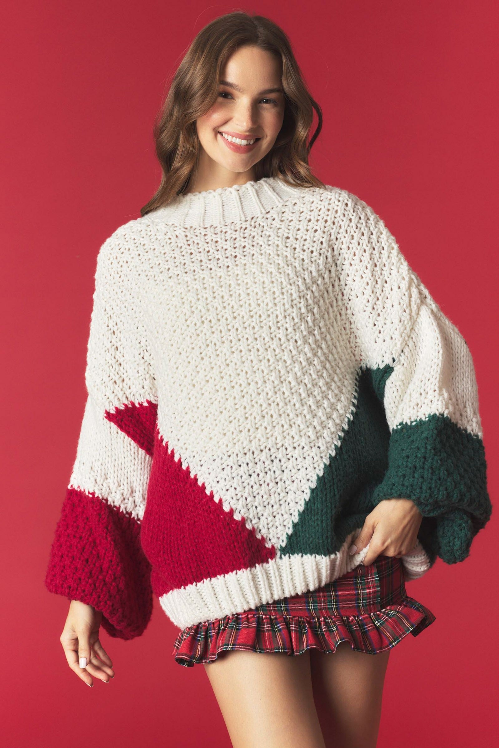 Mary color block knitted sweater by PEACH LOVE, featuring a stylish fall design with vibrant color blocks and cozy knit fabric.