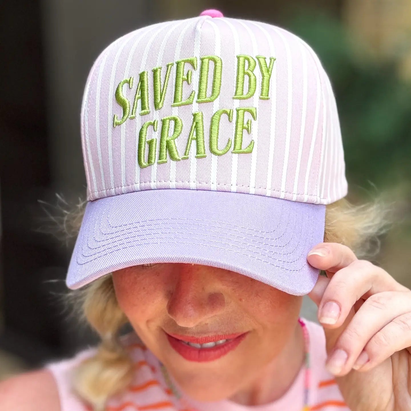 Saved By Grace baseball hat by TAYLOR ELLIOT DESIGNS, black cap with embroidered design, casual accessory for everyday wear.