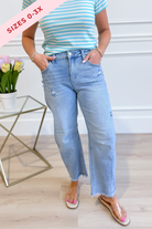 Risen Nolan high rise barrel jeans in 146 core style, showcasing dark wash denim and classic fit for women and men.