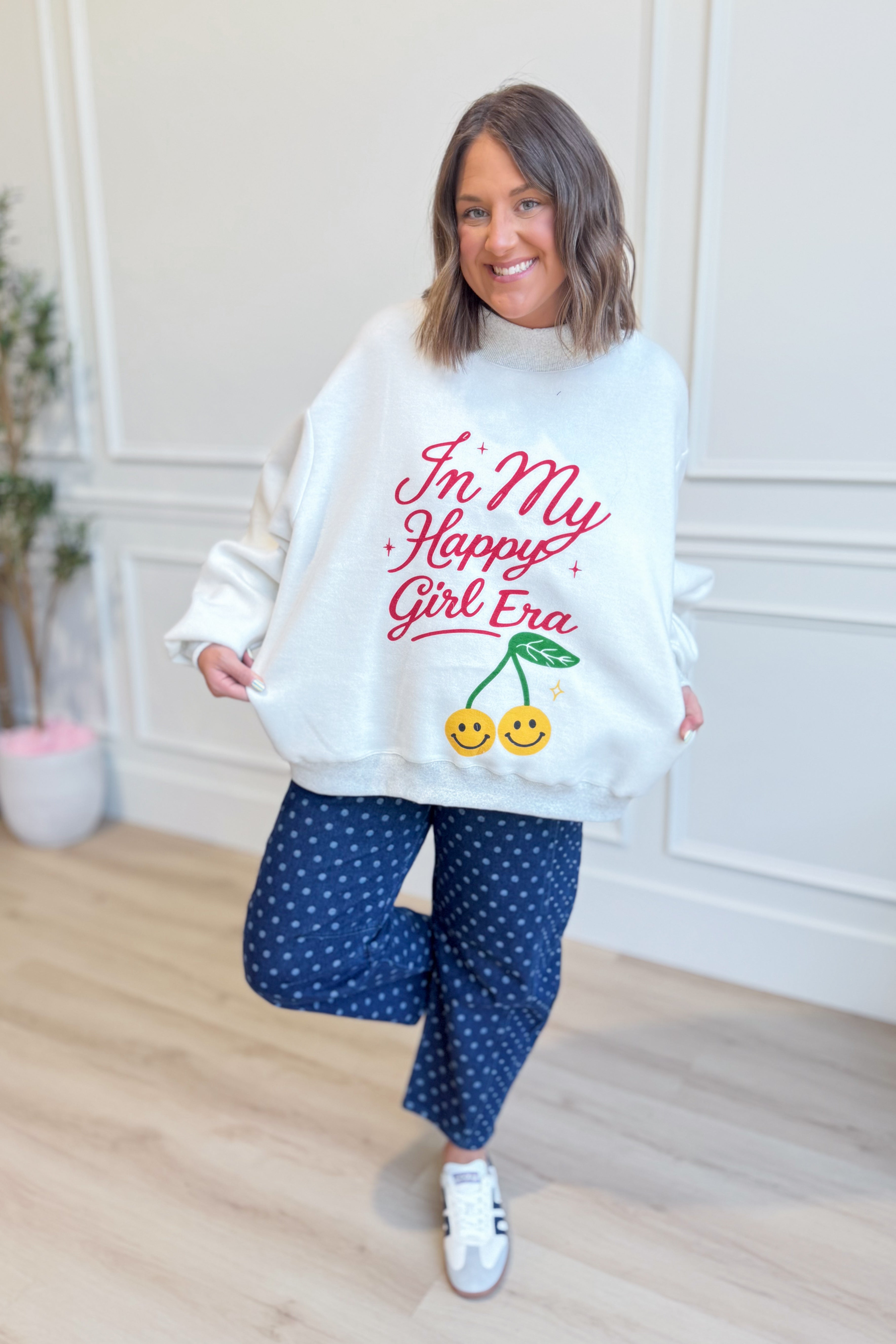 Reversible graphic sweatshirt from BUCKET LIST's In My Happy Girl Era 137 series, featuring vibrant colors and cozy fabric.
