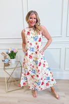 Zoe red botanical floral midi dress by ENTRO featuring a flowy silhouette and vibrant floral pattern, perfect for dressy occasions.