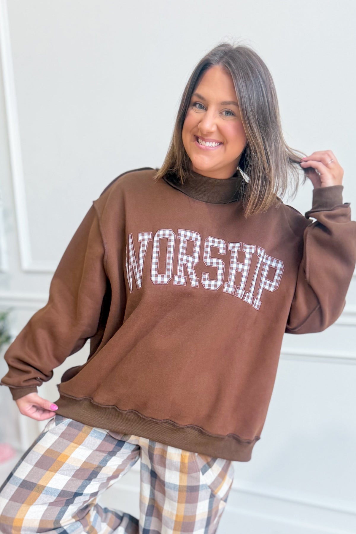 Worship Gingham Mock Neck Sweatshirt by BUCKET LIST, featuring a gingham pattern and a stylish mock neck design.