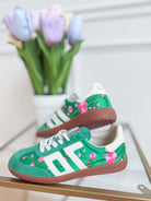 Green floral Ghost sneakers from BACK 70's 205 Sneakers collection featuring a sleek design and vibrant floral pattern.