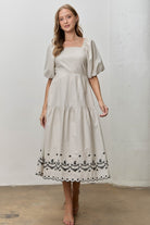 Baevely Jada embroidered striped midi dress with intricate embroidery and colorful stripes, perfect for dressy occasions.