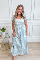 IN LOOM French floral cotton maxi dress with a flowing silhouette and vibrant floral pattern, perfect for dressy occasions.