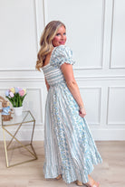 IN LOOM French floral cotton maxi dress with a flowing silhouette and vibrant floral pattern, perfect for elegant occasions.