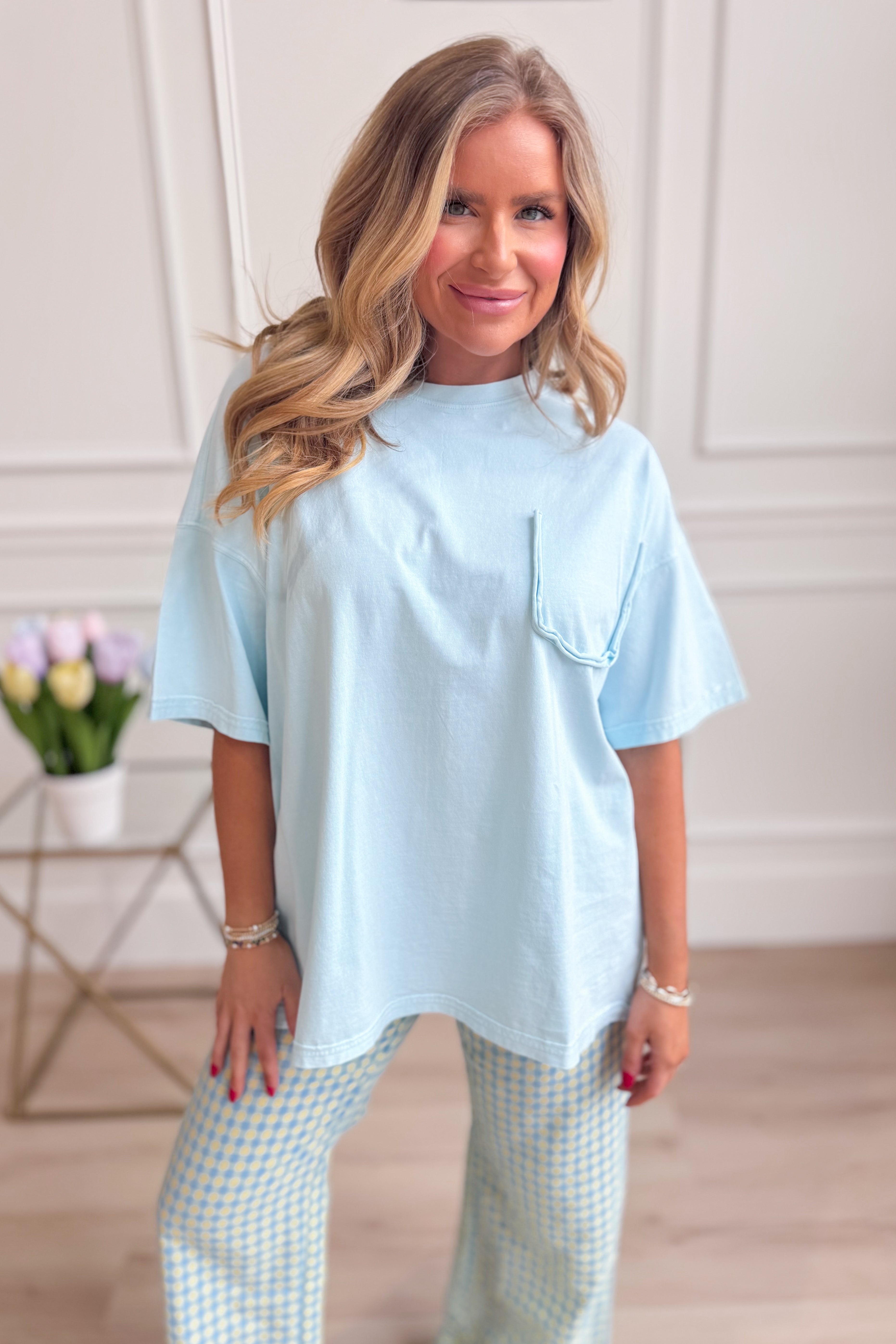 EASEL Leeland Basic Cotton Blue Top, casual 105 top made of soft cotton fabric, shown on a hanger against a plain background.