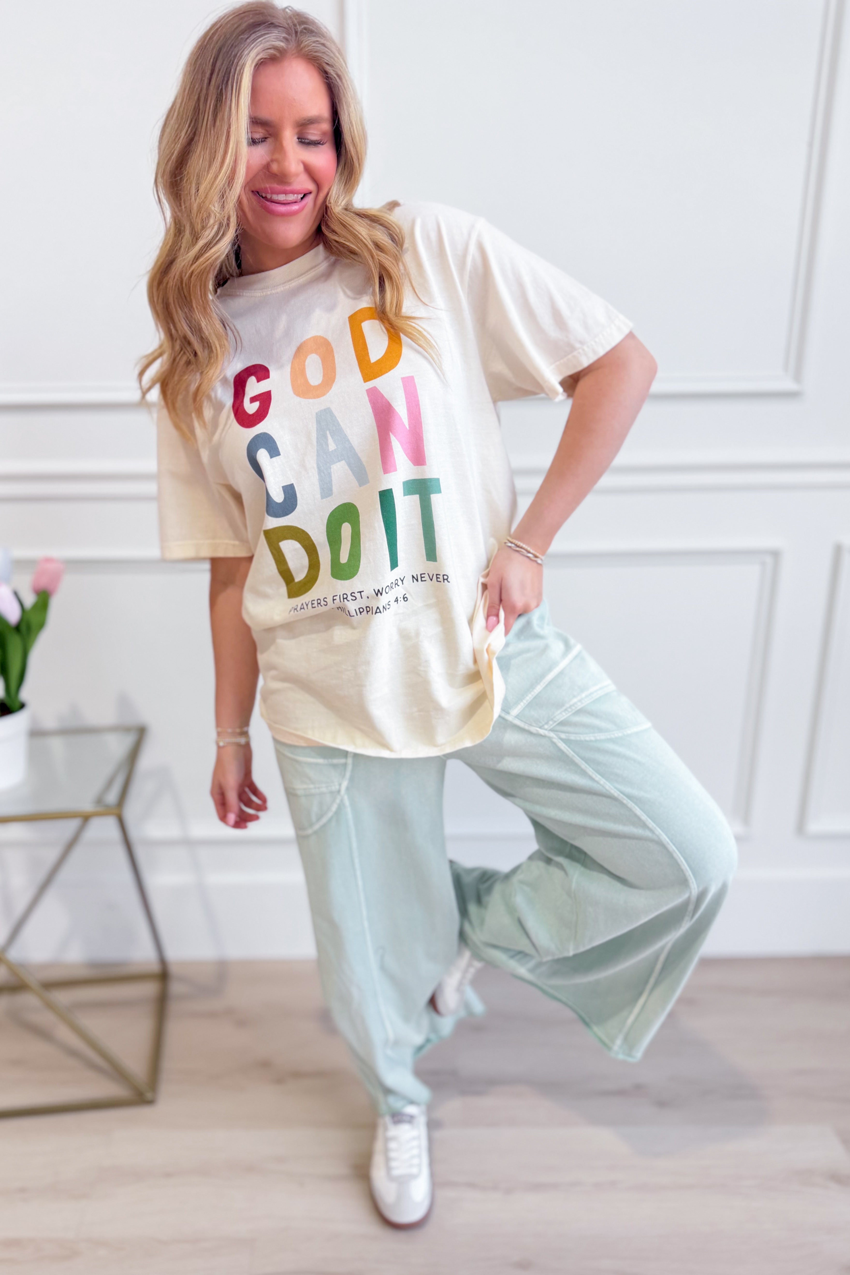 Poppy & Pine God Can Do It graphic T-shirt featuring bold text and casual fit, perfect for everyday wear.