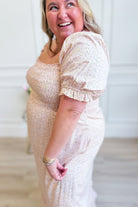 Luna Smocked Floral Maxi Dress by IN LOOM featuring a flowy silhouette, smocked bodice, and vibrant floral pattern.