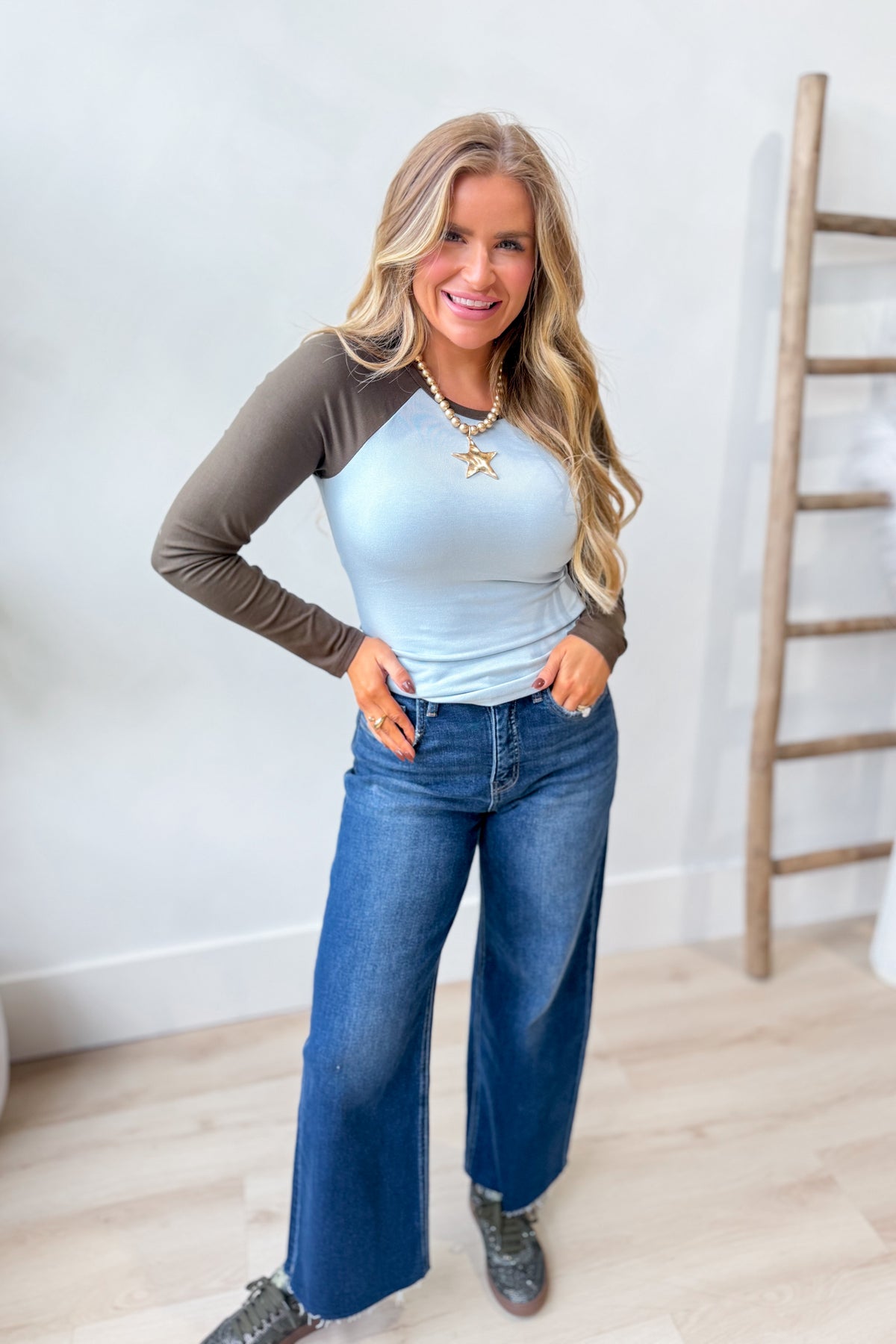 Baevely Randall contrast sleeve casual top with black and white design, long sleeves, and round neckline for stylish everyday wear.