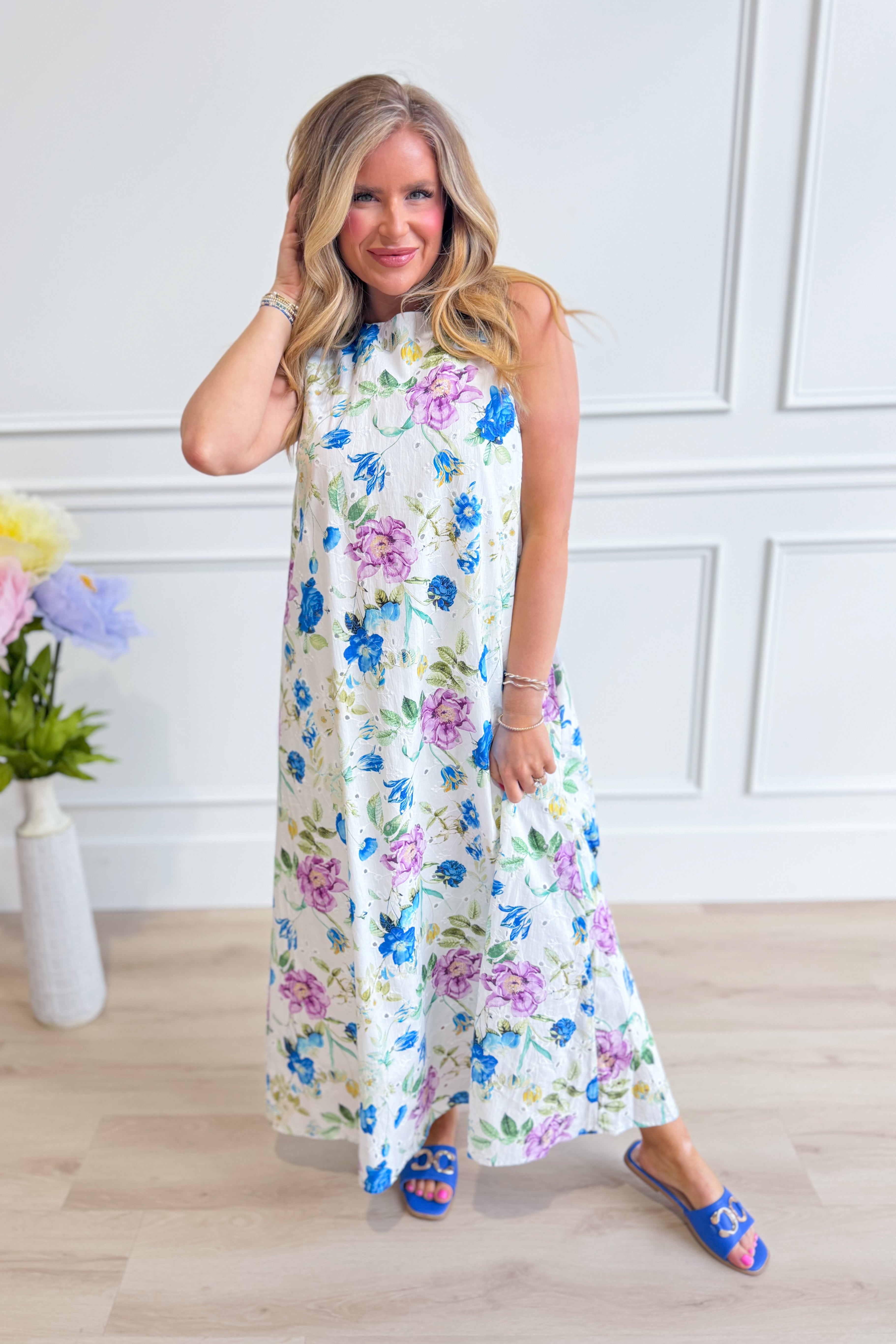 ENTRO Zoe Blue Botanical Floral Midi Dress featuring a flowy silhouette and vibrant floral print, perfect for elegant occasions.