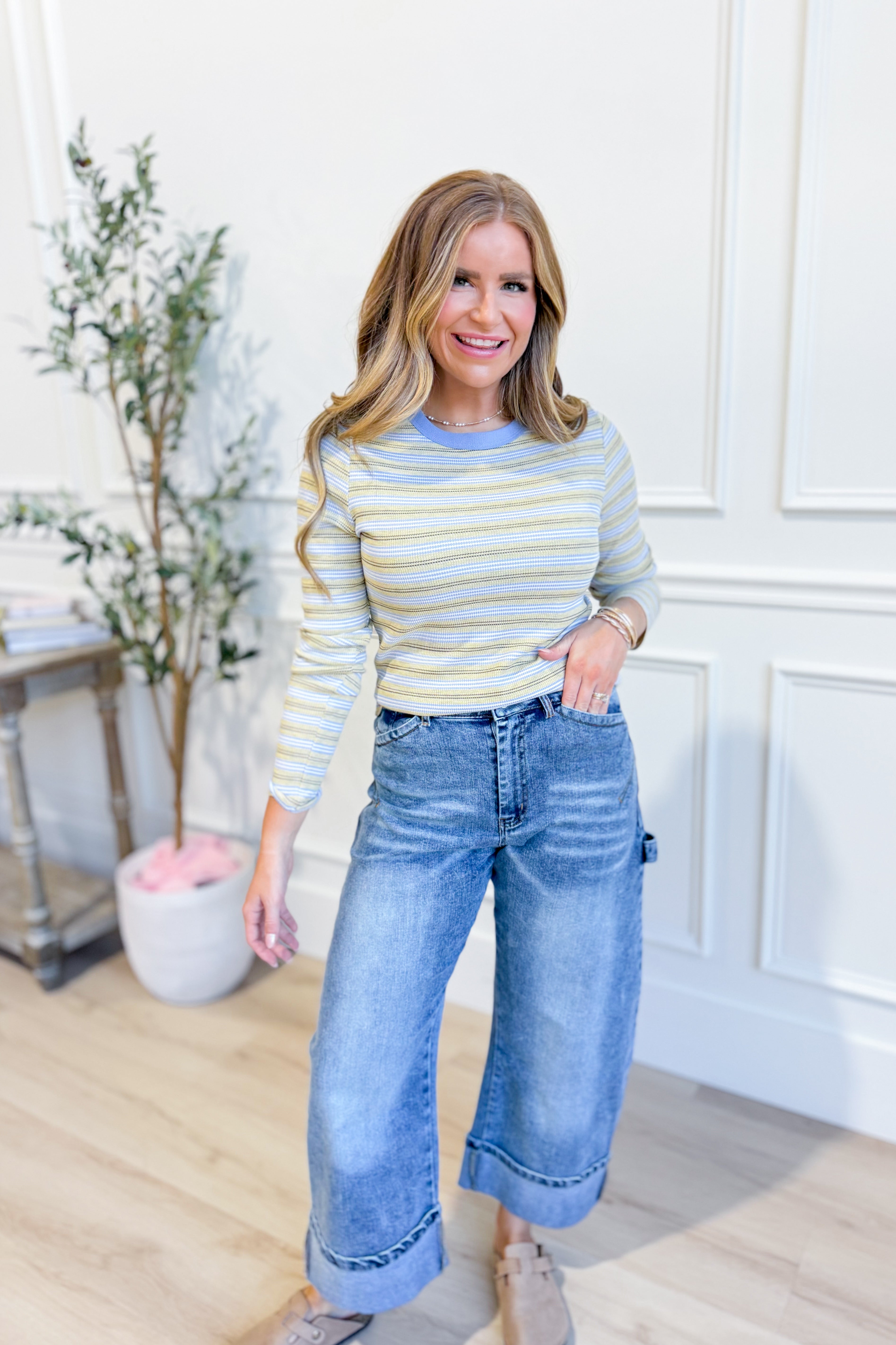 WISHLIST Kelly multi-striped long sleeve casual top with vibrant horizontal stripes and comfortable fit.
