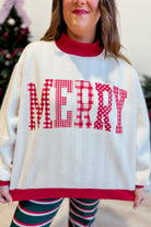 Reversible red and white striped graphic sweatshirt by PEACH LOVE featuring festive holiday design on soft cotton fabric.
