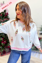 Mary Square Millie Nutcracker sequin pullover sweatshirt with festive nutcracker graphic and sparkling details