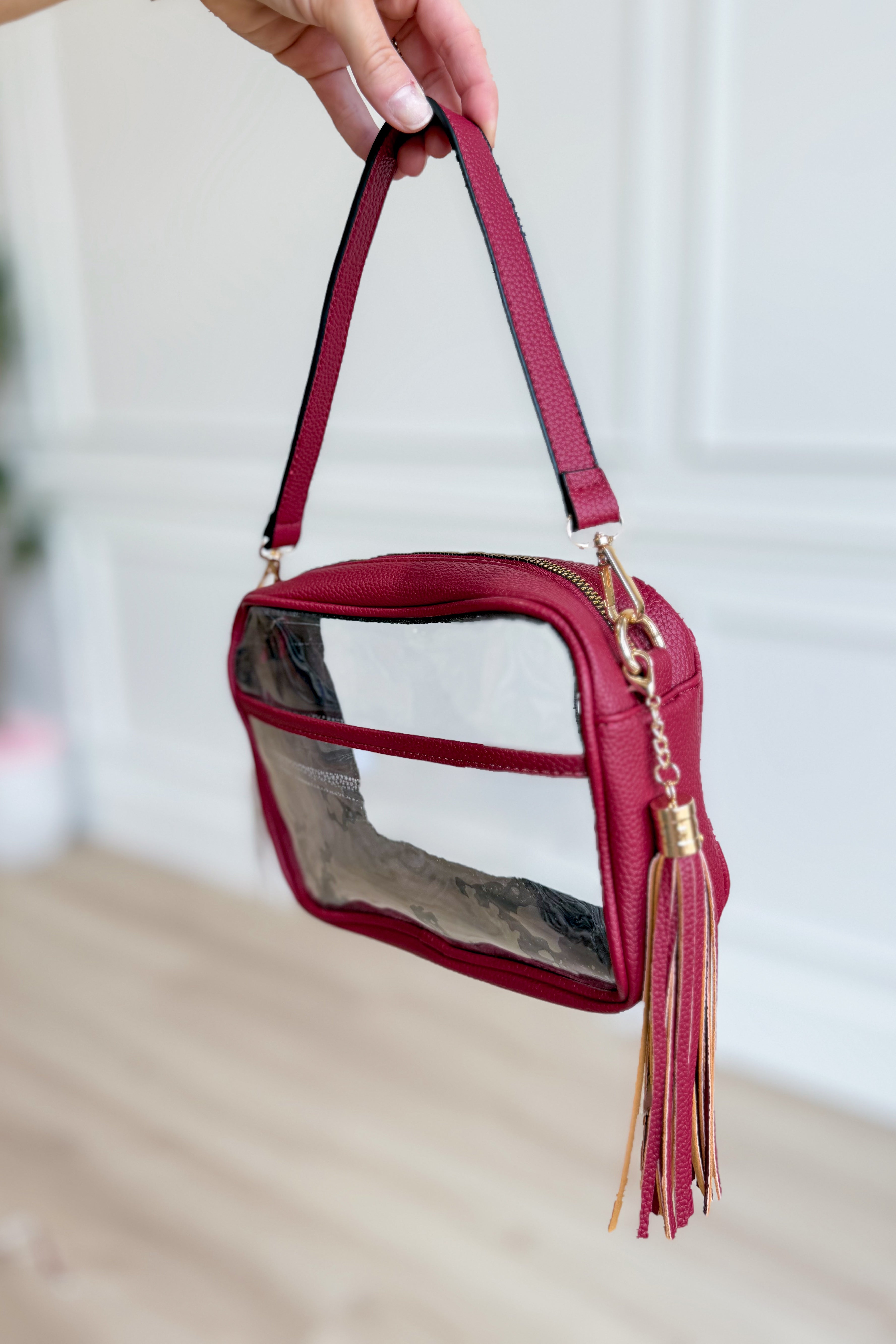 Burgundy clear stadium crossbody bag by QUEENS DESIGNS, featuring a transparent design with burgundy accents and adjustable strap.