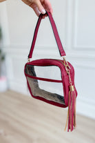 Burgundy clear stadium crossbody bag by QUEENS DESIGNS, featuring a transparent design with burgundy accents and adjustable strap.