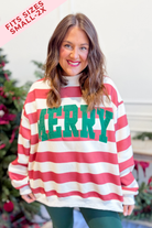 Black embroidered Merry striped mock neck sweatshirt from BUCKET LIST's 137 graphic sweatshirt collection featuring festive holiday design.
