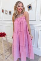 Red gingham printed maxi dress by PEACH LOVE featuring a flowy silhouette and sleeveless design for a stylish, dressy look.