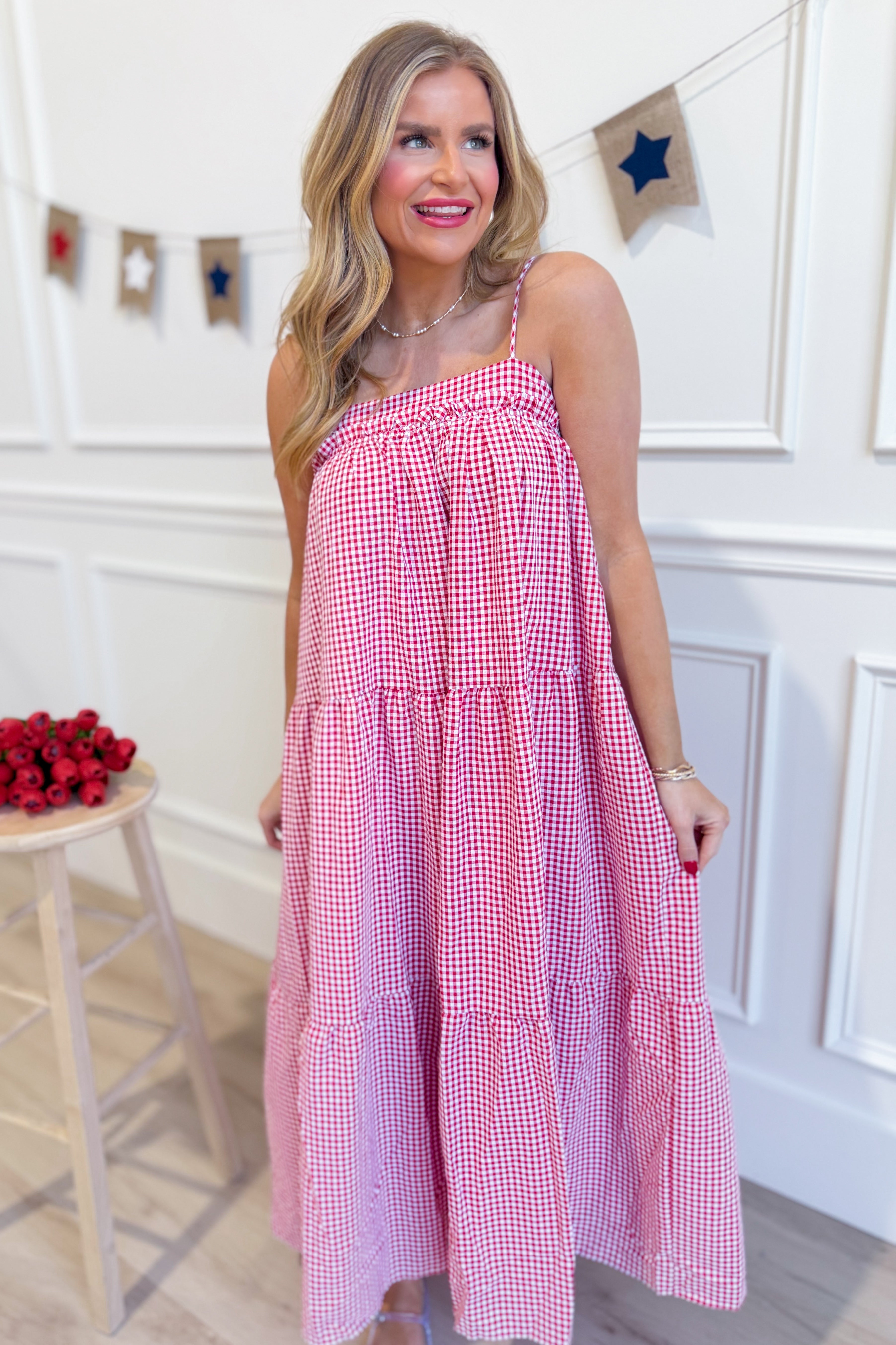 Red gingham printed maxi dress by PEACH LOVE featuring a flowy silhouette and sleeveless design for a stylish, dressy look.