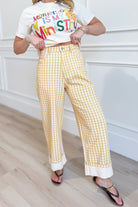 Luis Lt Yellow Gingham Rolled Hem Barrel Pant from PEACH LOVE, casual novelty jeans with a yellow gingham pattern and rolled hem detail.