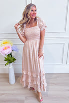 IN LOOM Luna smocked floral maxi dress with ruffled hem and flowing fabric, perfect for dressy occasions.